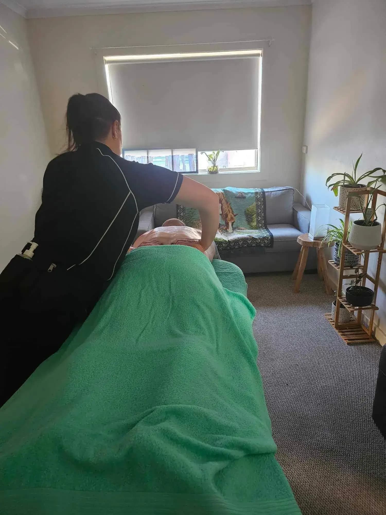 Sarah Grapentin delivering a remedial massage at her Port Pirie clinic